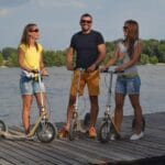 two woman and a man with Boardies