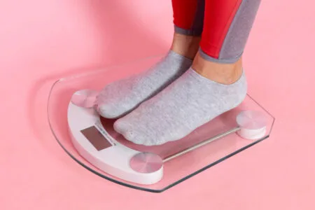 a scaler with pink background