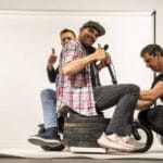 Extreme load test of the Boardy scooter: it held 450 kg (1000 lbs) without damage, even as the deck nearly touched the ground.