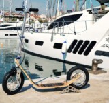 Dockside Mobility - No Batteries, No Fuss. boardy next to a boat