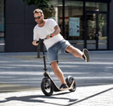Kickscooter For Fun a man riding boardy
