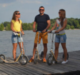 Boardy = Social Ride Vibes a group of people with boardies on a dock