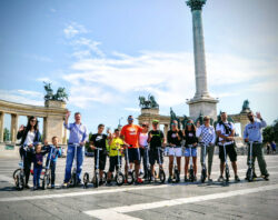 Join The Movement from our friends - group of boardy riders lined up in front of heroes’ square in budapest.