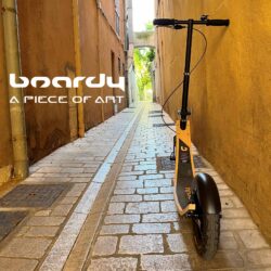A Piece Of Art boardy scooter in a narrow cobblestone alley. a piece of art.