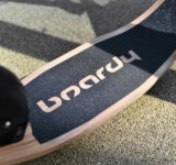 Logo Close-Up close-up of the boardy deck logo with deck curve on a walkway.